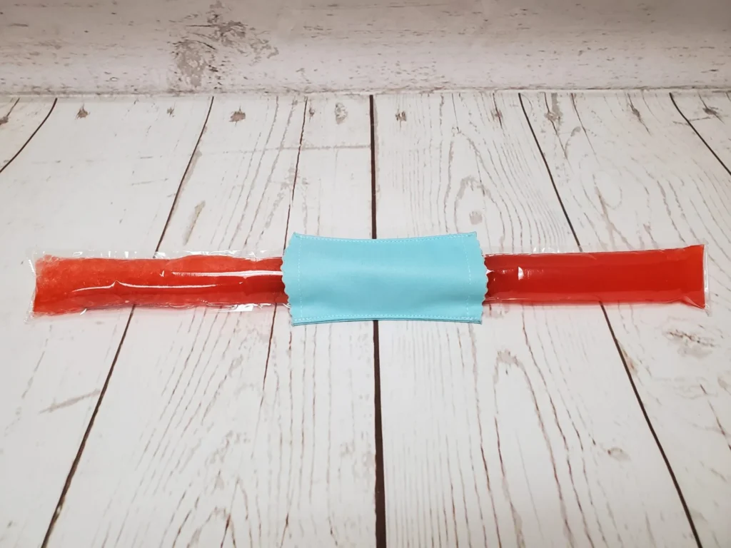 Couvre bâton glacé Taille & Retailles en tissu Aqua