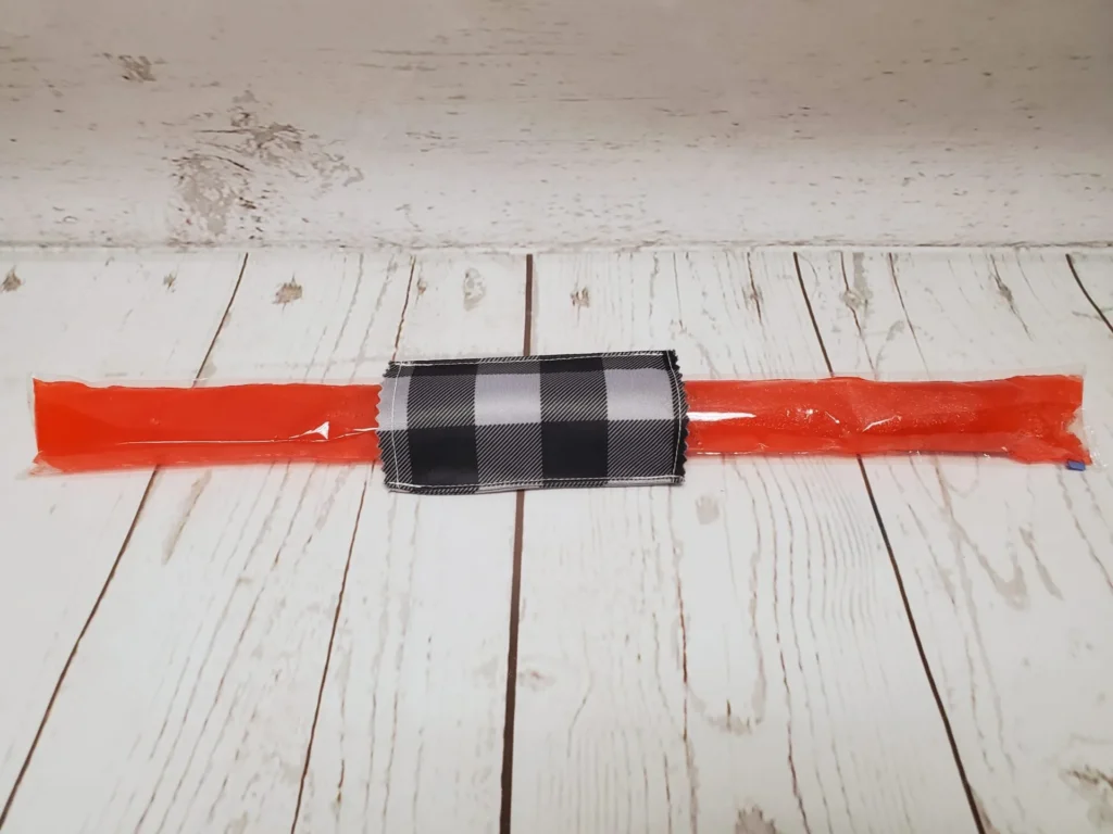 Couvre bâton glacé Taille & Retailles en tissu Carreauté gris