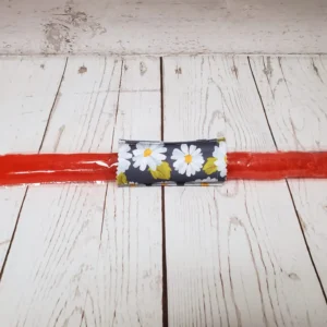 Couvre bâton glacé Taille & Retailles en tissu Marguerites